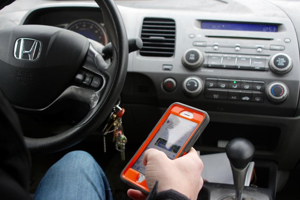 Lawmakers in the Michigan House of Representatives are advancing a plan to ban all cell phone use that isn't handsfree while driving.