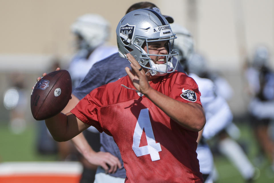 Las Vegas Raiders quarterback Aidan O'Connell (4) throws during practice at the NFL football team’s training camp, Saturday, July 29, 2023, in Henderson, Nev. (AP Photo/Sam Morris)