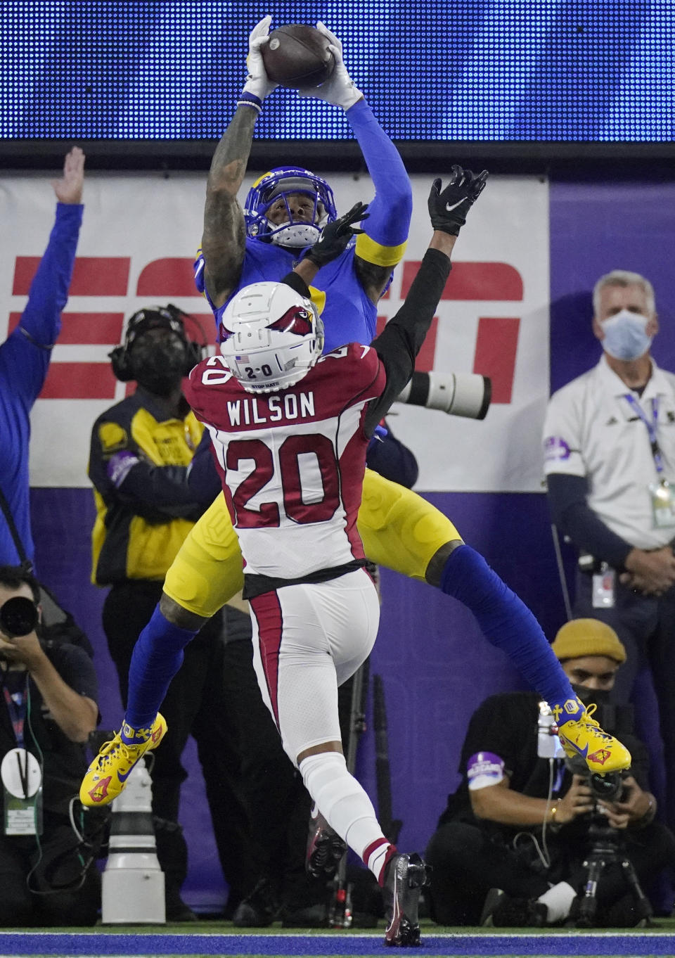 Los Angeles Rams wide receiver Odell Beckham Jr., top, catches a touchdown against Arizona Cardinals cornerback Marco Wilson (20) during the first half of an NFL wild-card playoff football game in Inglewood, Calif., Monday, Jan. 17, 2022. (AP Photo/Mark J. Terrill)