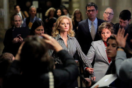 Summer Zervos, a former contestant on The Apprentice, leaves New York State Supreme Court with attorney Gloria Allred (R) after a hearing on the defamation case against U.S. President Donald Trump in Manhattan, New York City, U.S., December 5, 2017. REUTERS/Andrew Kelly