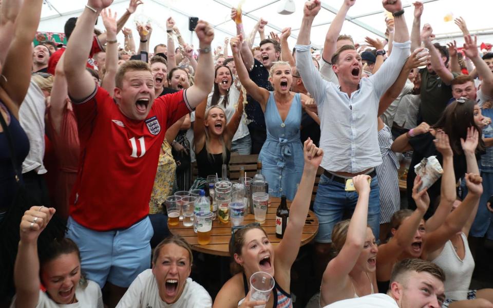 Fans react to England's second goal from Dele Alli in the World Cup 2018 quarter-final match between Sweden and England at the Rose & Crown pub, Wimbledon, South London. - PA