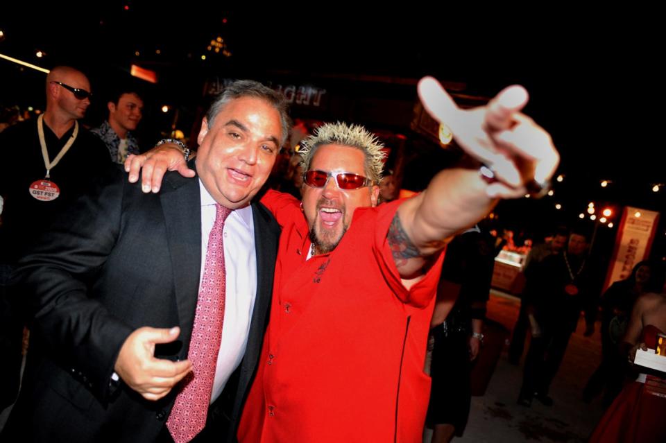 Guy Fieri shares a 2010 fest moment with Lee Brian Schrager, founder and director of the South Beach Wine and Food Festival.