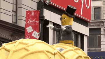 Mister Peanut character dabs during a parade