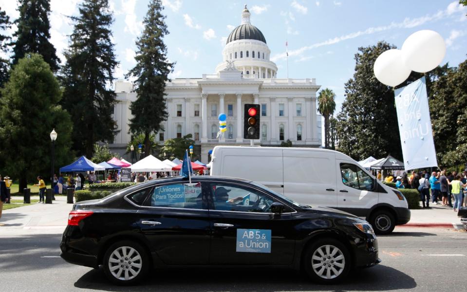 Supporters of the law circle the Capitol during a rally in Sacramento, California, last year. - Rich Pedroncelli /AP