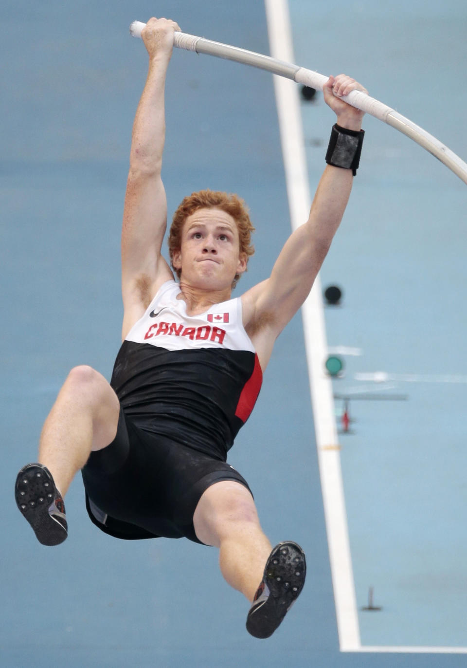 FILE - Canada's Shawn Barber competes in the men's pole vault qualification at the World Athletics Championships in the Luzhniki stadium in Moscow, Russia, Saturday, Aug. 10, 2013. Barber has died from medical complications. He was 29. Barber died Wednesday, Jan. 17, 2024, at home in Kingwood, Texas, his agent, Paul Doyle, confirmed to The Associated Press. (AP Photo/Ivan Sekretarev, File)
