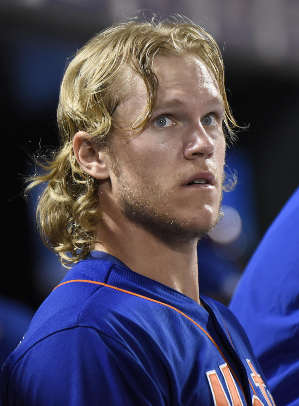 FILE - New York Mets pitcher Noah Syndergaard watches from the dugout after leaving the baseball game against the Arizona Diamondbacks on Friday, July 10, 2015, in New York. Syndergaard earned the moniker “Thor” for his flowing blonde locks. Astros starters Framber Valdez and Luis Garia look like naturals on the mound, but they've gotten an artificial boost from the barber shop. Both pitchers got hair extensions during this season. (AP Photo/Bill Kostroun, File)