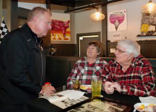 <em>IndyCar president Jay Frye talks with two-time Indy 500 winner Gordon Johncock at his Baby Borg ceremony (Bruce Martin).</em>