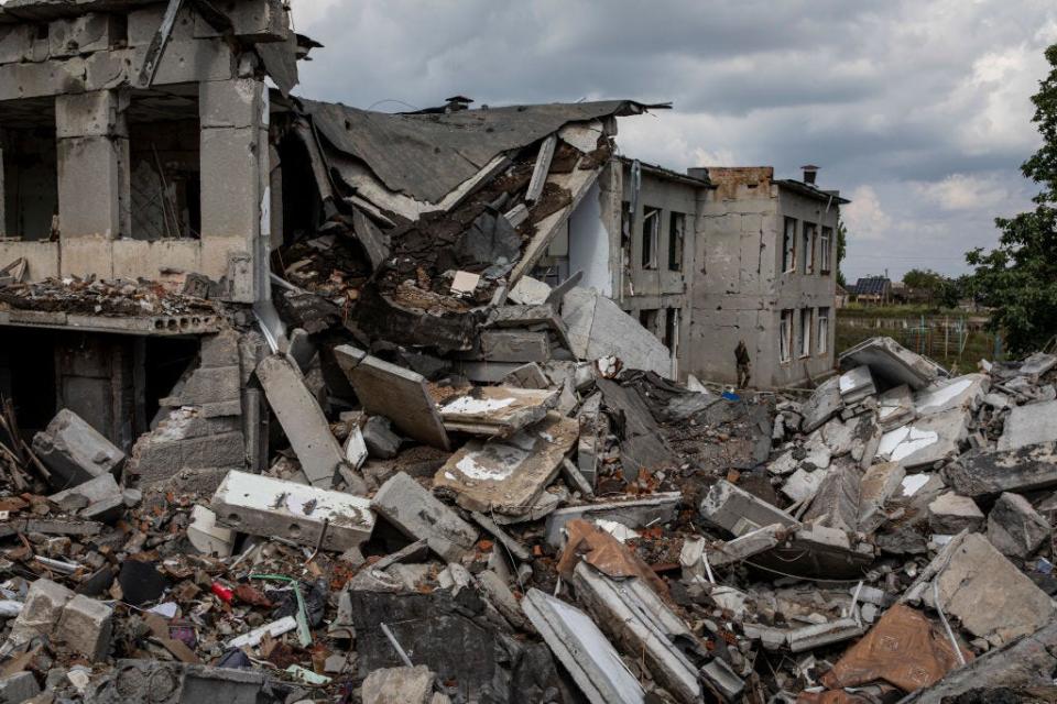 A Ukrainian soldier seen at the school destroyed by a Russian airstrike in Mykolaiv Oblast.