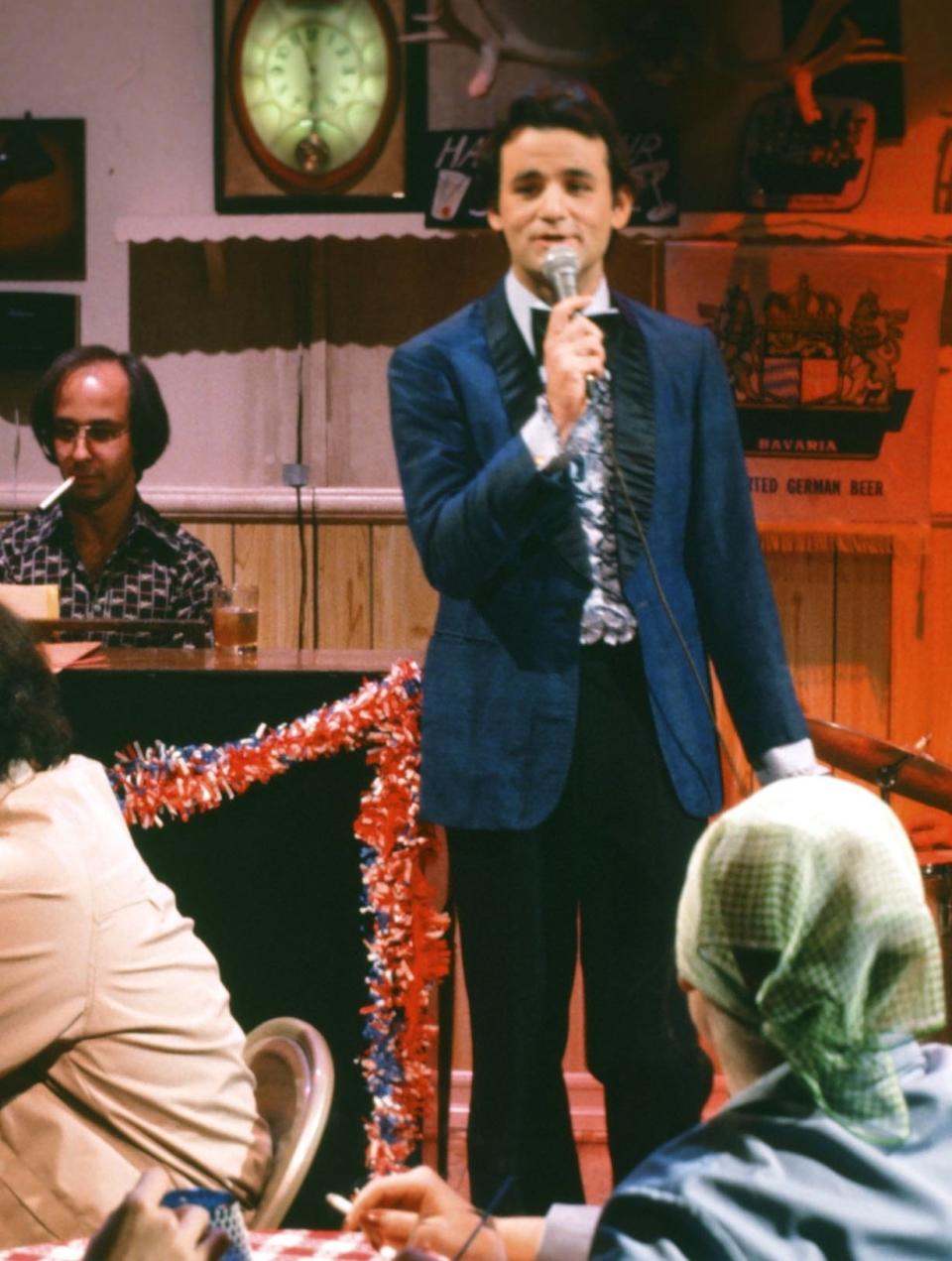Paul Shaffer, Bill Murray as Nick Summers during the 'Nick Summers' skit on April 16, 1977