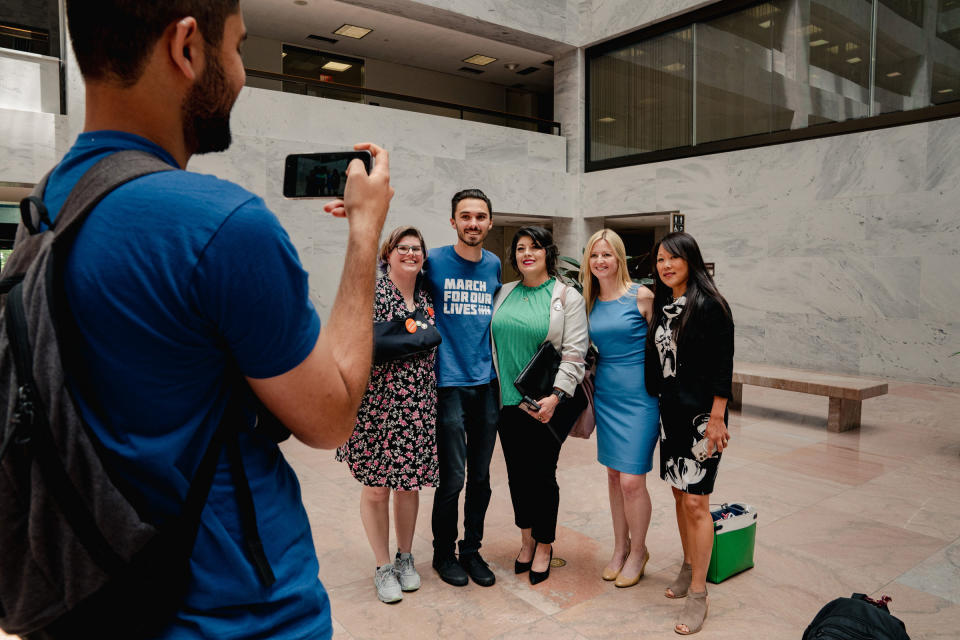 David Hogg takes group photos with his fellow survivors and activists as they lobby to push for Congress to enact tougher gun control measures at the Hart Senate Office Building in Washington, D.C., on Tuesday, June 9, 2022.<span class="copyright">Shuran Huang for TIME</span>