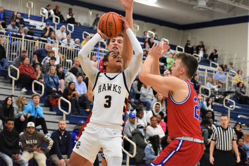 Decatur Central's KC Berry (3) fights through Martinsville defenders during the Hawks' matchup with the Artesians on Jan. 6, 2023.