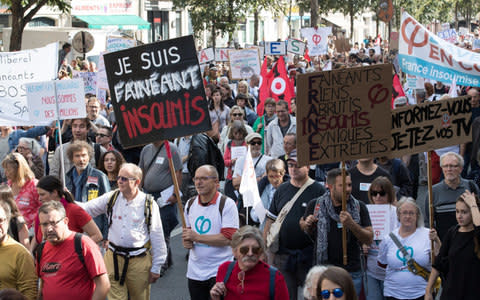 Protestors march during a "France Insoumise" (France Unbowed) party's demonstration against the government's labour reforms in Paris, France, September 23 - Credit:  REUTERS