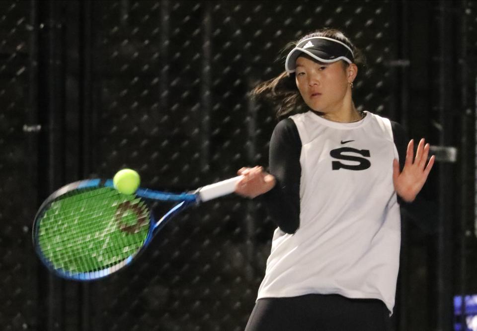 Scarsdale's Natalie Hu  returns a shot to Harrison's Hannah Rose during the Section One Division One girls tennis team finals at Harrison High School, Oct. 18, 2022. 