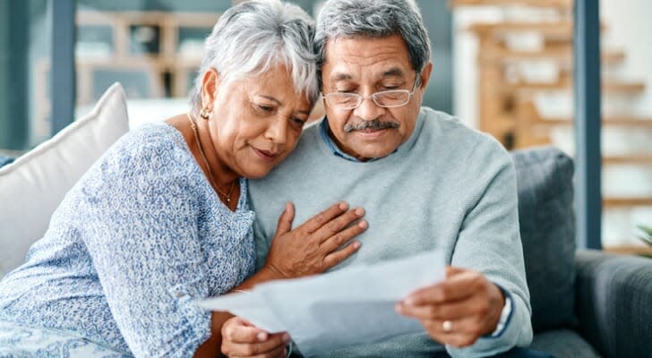 Senior couple checks their dividends