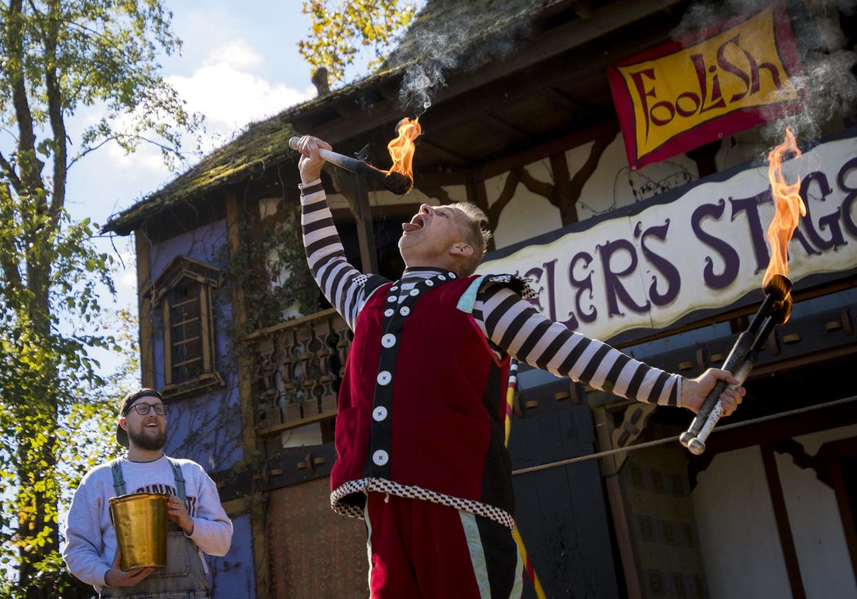 Stage performer Moonie tries to blow out his fire sticks during the 2018 Ohio Renaissance Festival. The 33rd annual festival starts Sept. 3, 2022.