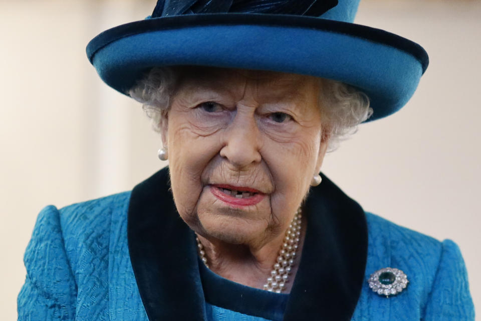 Queen Elizabeth in blue suit visits the new headquarters of the Royal Philatelic society on November 26, 2019 