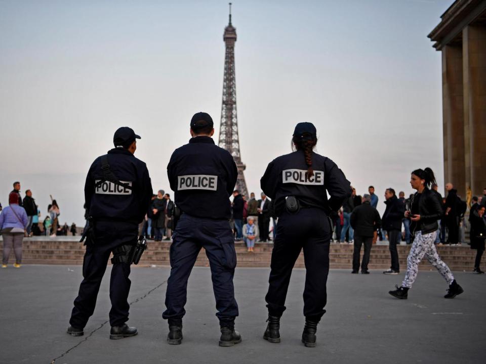 Police in front of the Eiffel Tower in Paris the day after a gunman opened fire on officers on the Champs-Elysees (Getty Images)