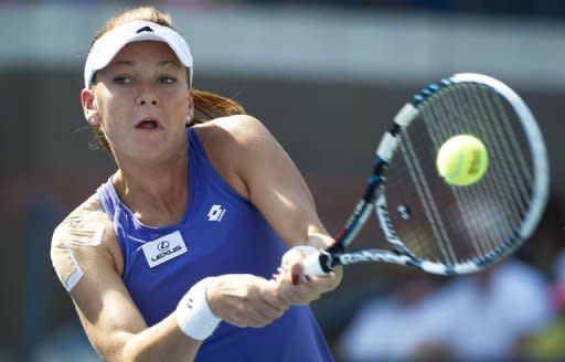 Agnieszka Radwanska of Poland hits a return to Carla Suarez Navarro of Spain at the 2012 US Open tennis tournament August 30, 2012 in New York. Radwanska beat Suarez Navarro 4-6, 6-3, 6-0