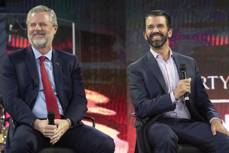 Donald Trump Jr., right, and Liberty University president Jerry Falwell Jr. attend a panel discussion at a Liberty University Convocation, Wednesday, Nov. 13, 2019, in Lynchburg, Va. (AP Photo/Don Petersen)