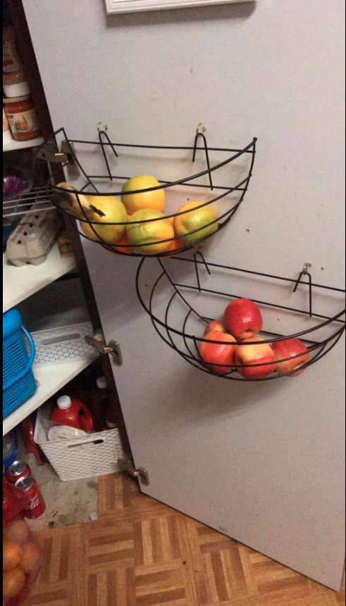 For those with little space, one mum hung two plant baskets inside her pantry door to keep her fruit nice and fresh. Photo: Facebook/Kmart Mums Australia