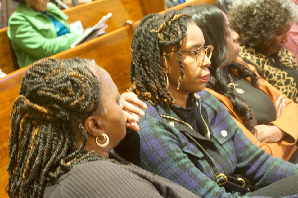 Shelia Harper and Tawanna Chapman, residents of West Jackson, sit and listen while the Jackson City Council debates funding a project that would build a 60-unit tiny home village to house the city's homeless. Harper and Chapman oppose the project.