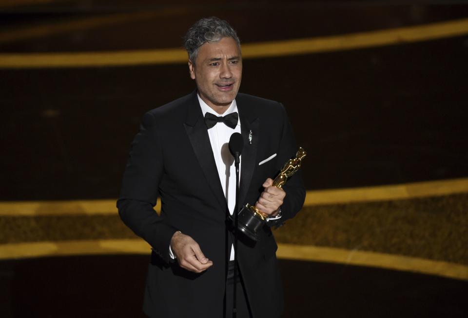 Taika Waititi accepts the award for best adapted screenplay for “Jojo Rabbit” at the Oscars on Sunday, Feb. 9, 2020, at the Dolby Theatre in Los Angeles.