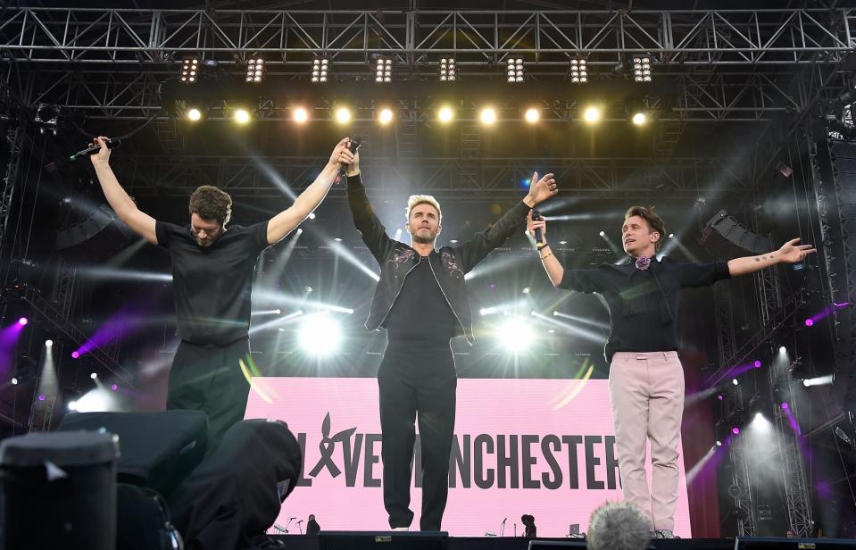 <p>Take That soak up the adulation after performing at Old Trafford (Getty) </p>