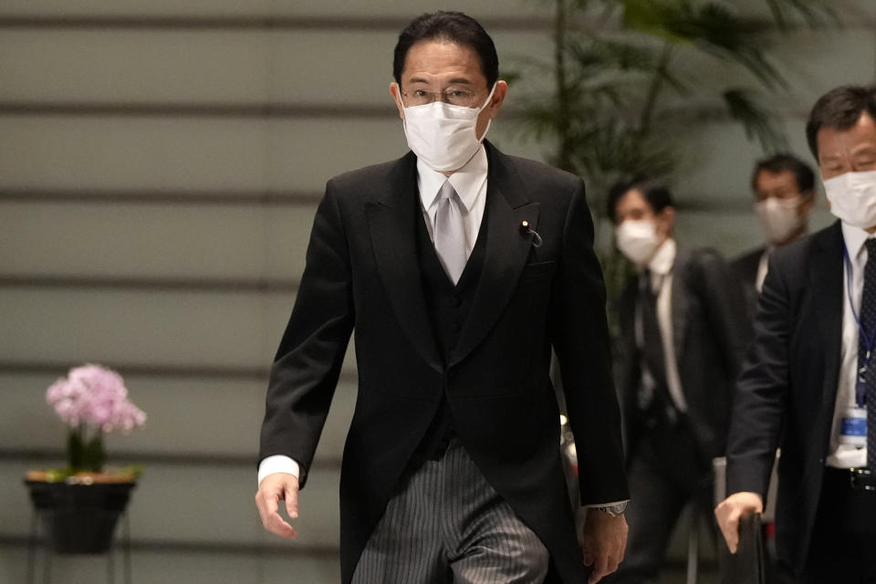 Japanese Prime Minister Fumio Kishida arrives at the prime minister's official residence after he and his ministers attended the attestation ceremony of his cabinet at the Imperial Palace Monday, Oct. 4, 2021, in Tokyo. Japan's parliament on Monday elected Kishida, a former moderate turned hawk, as prime minister. (AP Photo/Shuji Kajiyama)