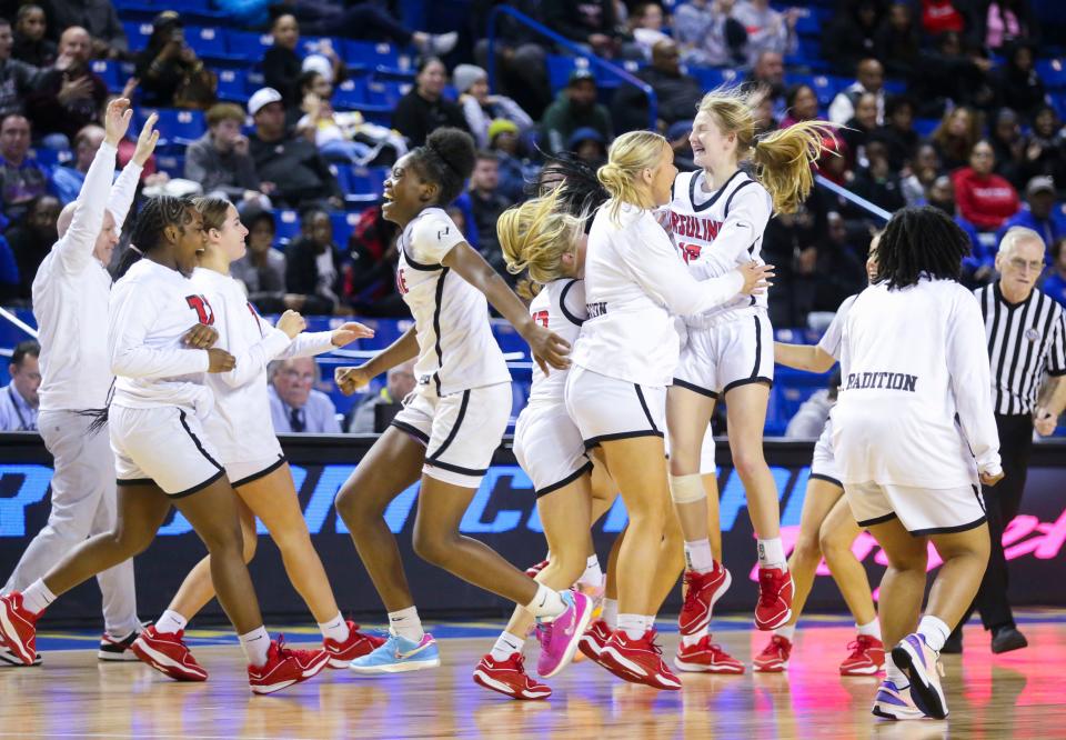 Ursuline begins the celebration after the Raiders' 37-34 win over Sanford in a DIAA state tournament semifinal at the Bob Carpenter Center, Wednesday, March 6, 2024.
