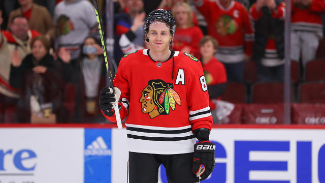 Patrick Kane being heavily pursued by Canadian team