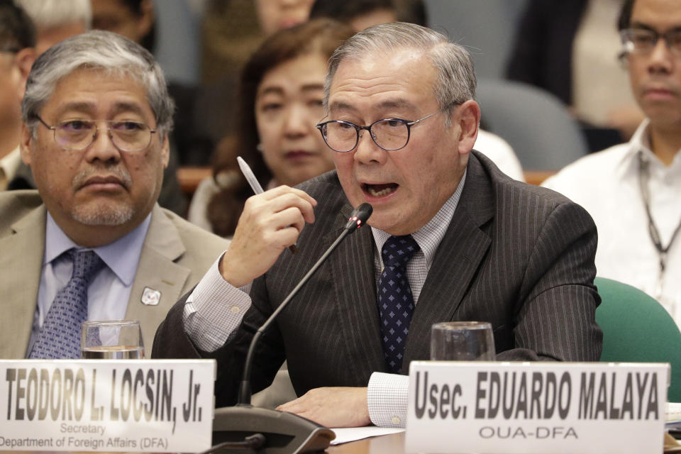 FILE - In this Feb. 6, 2020, file photo, Philippine Secretary of Foreign Affairs Teodoro Locsin Jr. gestures during a senate hearing in Manila, Philippines. The Philippines on Tuesday notified the United States of its intent to terminate a major security pact allowing American forces to train in the country in the most serious threat to the countries’ treaty alliance under President Rodrigo Duterte. (AP Photo/Aaron Favila, File)