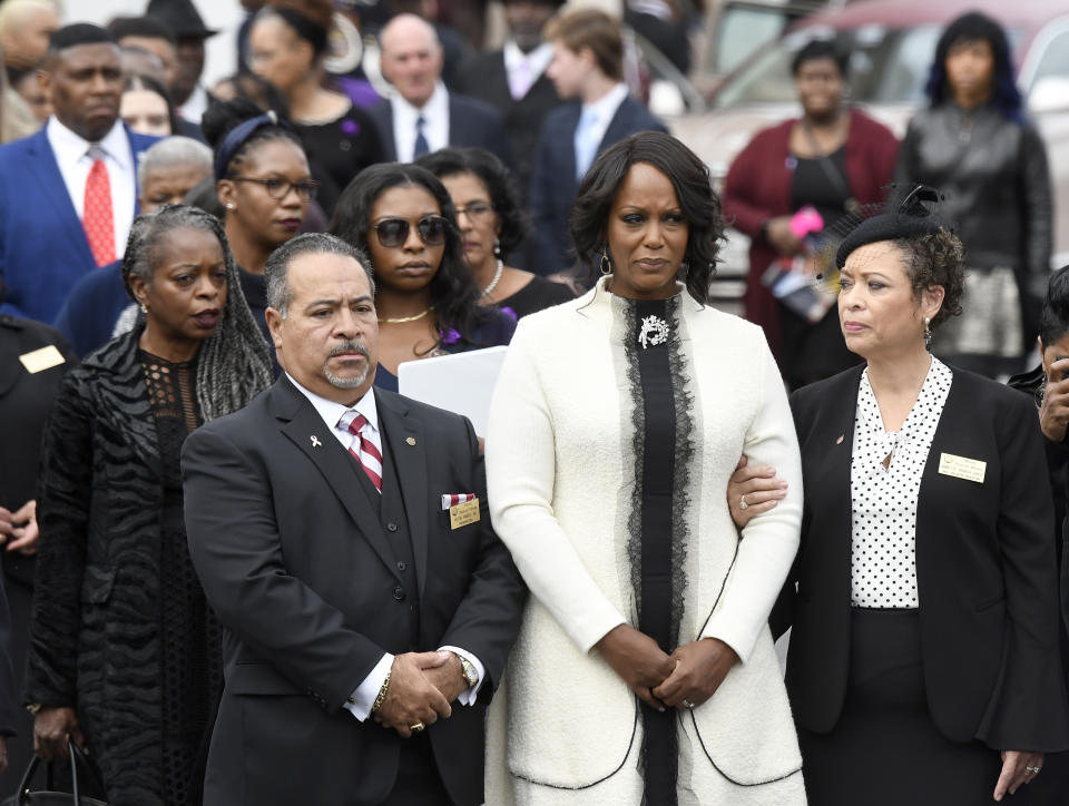 Maya Rockeymoore Cummings, second from right, watches pallbearers move the casket of her husband, Rep. Elijah Cummings, at the conclusion of his funeral service at New Psalmist Baptist Church, Friday, Oct. 25, 2019, in Baltimore. The Maryland congressman and civil rights champion died Thursday, Oct. 17, at age 68 of complications from long-standing health issues. (AP Photo/Steve Ruark)