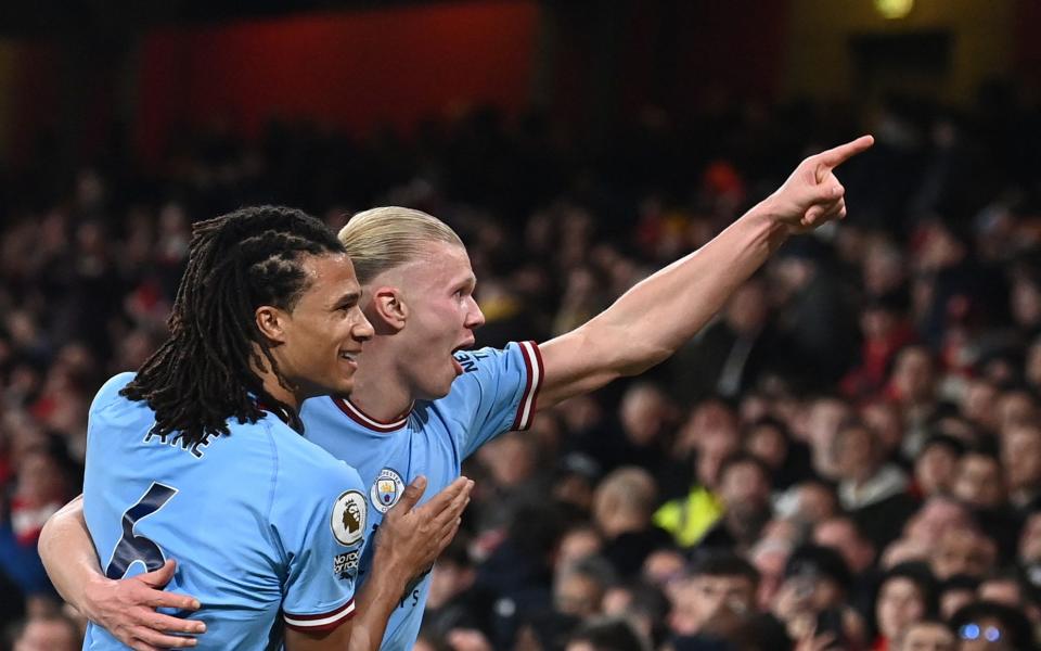 Manchester City's Norwegian striker Erling Haaland (R) celebrates with teammates after scoring his team third goal during the English Premier League football match between Arsenal and Manchester City at the Emirates Stadium in London on February 15, 2023 - GLYN KIRK/AFP via Getty Images