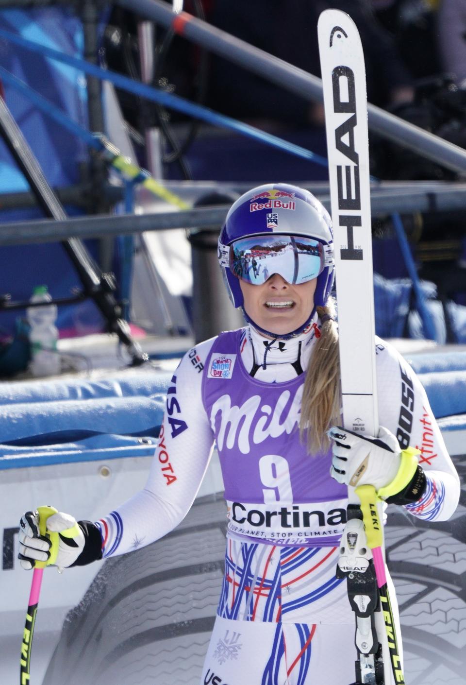 United States' Lindsey Vonn checks her time at the finish area of an alpine ski, women's World Cup downhill in Cortina D'Ampezzo, Italy, Saturday, Jan. 19, 2019. (AP Photo/Giovanni Auletta)