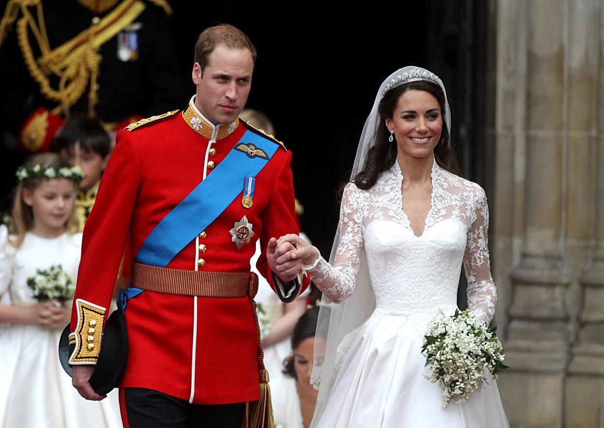 Prince William and his wife Catherine, Duchess of Cambridge emerge from Westminster Abbey after the wedding ceremony.   (Photo by Lewis Whyld/PA Images via Getty Images)