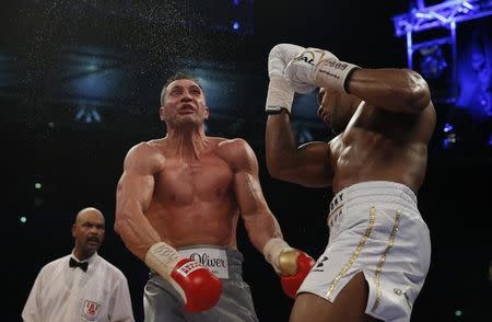 Britain Boxing - Anthony Joshua v Wladimir Klitschko IBF, IBO & WBA Super World Heavyweight Title's - Wembley Stadium, London, England - 29/4/17 Anthony Joshua in action with Wladimir Klitschko Action Images via Reuters / Andrew Couldridge