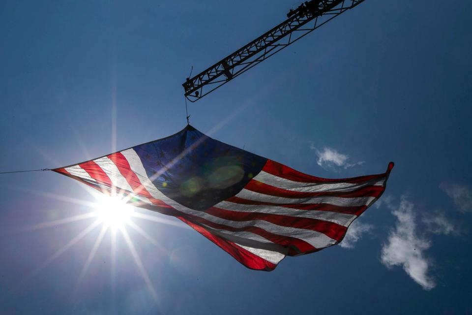 The American flag flies over the Ocala Marion County Veterans Memorial Park during a community event in remembrance of Memorial Day, Monday, May 31, 2021, in Ocala.