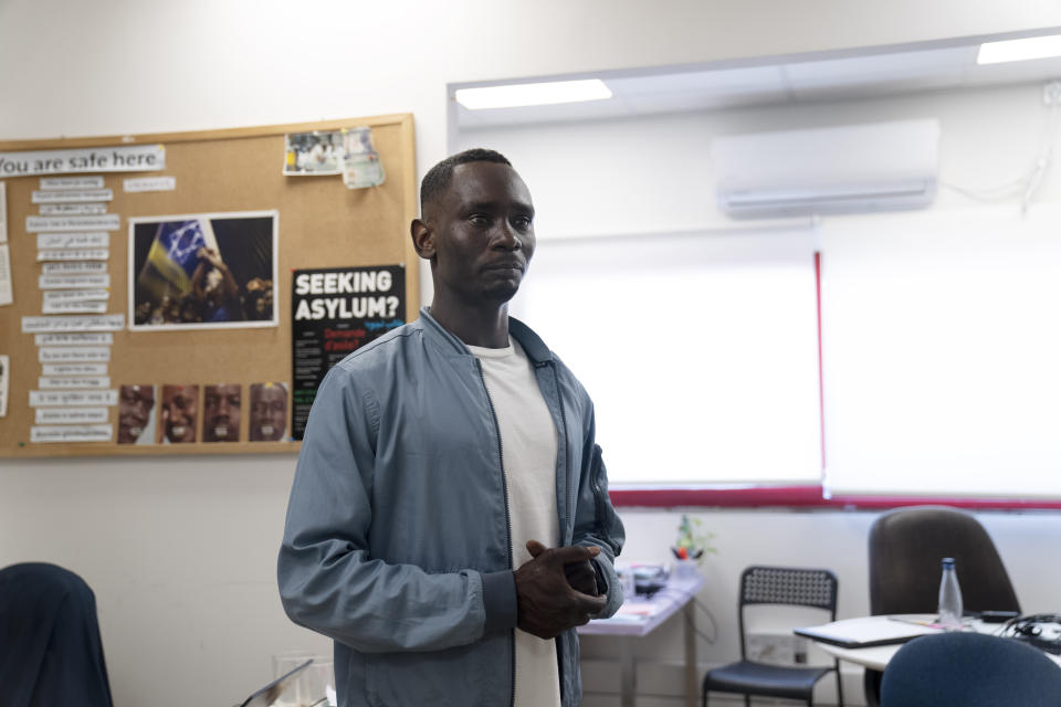 Omer Easa poses for a portrait at the offices of the Hotline for Migrant Workers in Tel Aviv, Israel, Sunday, April 30, 2023. Easa is watching the violence in his home country Sudan with deep trepidation. "My heart is there. My head is there. It is just that my body is here," said Easa, 31, a political dissident who fled the war-torn region of Darfur in 2012. "We live here often thanks to the graces of the Supreme Court." (AP Photo/Maya Alleruzzo)