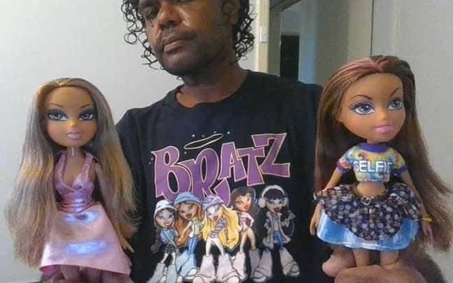 Terence Darrell Kelly, 36, poses with his dolls