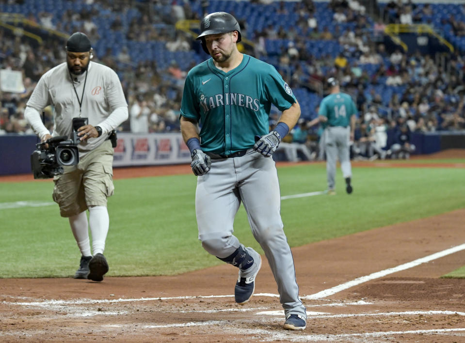 Seattle Mariners' Cal Raleigh heads for the dugout after hitting a solo home run off Tampa Bay Rays starter Taj Bradley during the fourth inning of a baseball game Monday, June 24, 2024, in St. Petersburg, Fla. (AP Photo/Steve Nesius)
