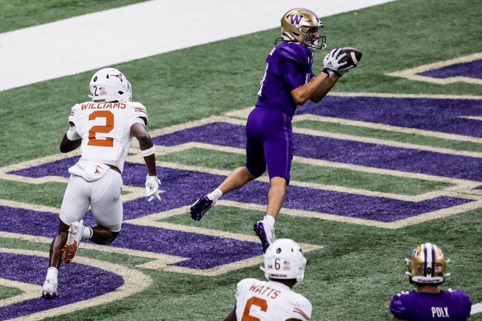 Washington wide receiver Jalen McMillan (11) makes a touchdown catch against Texas during the second half of the Sugar Bowl CFP NCAA semifinal college football game, Monday, Jan. 1, 2024, in New Orleans. (AP Photo/Butch Dill)
