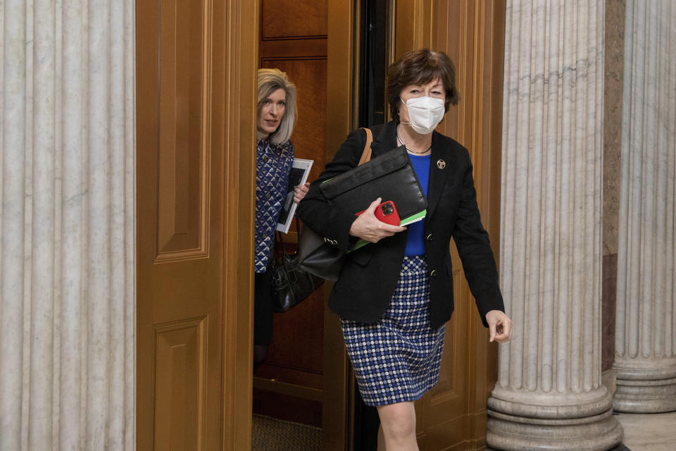 Sen. Susan Collins, R-Maine, followed by Sen. Joni Ernst, R-Iowa, at the Capitol.