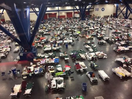 Evacuees take shelter from Tropical Storm Harvey in the George R. Brown Convention Center in Houston, Texas, U.S. in this August 28, 2017 handout photo. Texas Military Department/Handout via REUTERS