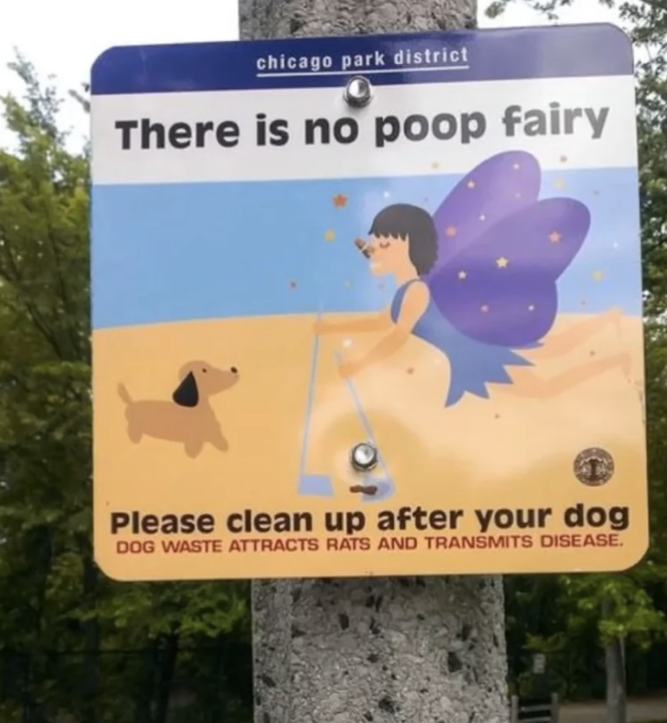 A sign from Chicago Park District depicting a fairy and dog, stating: "There is no poop fairy. Please clean up after your dog. Dog waste attracts rats and transmits disease."