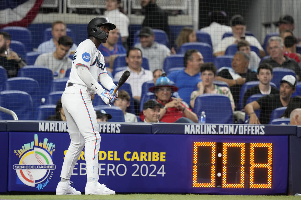 Miami Marlins' Jazz Chisholm Jr. prepares to bat as the pitch clock runs during an opening day baseball game against the New York Mets, Thursday, March 30, 2023, in Miami. (AP Photo/Lynne Sladky)