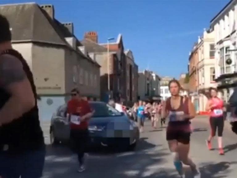 Woman wreaks havoc by driving on to course in middle of half-marathon in Plymouth