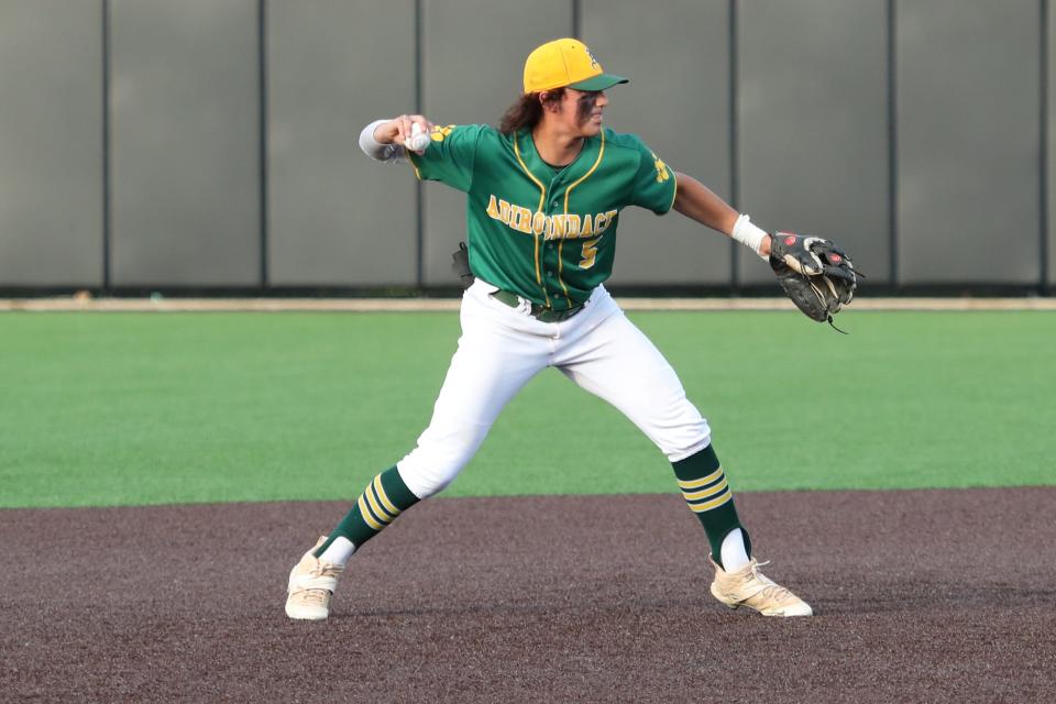 Jacob Khouri makes the throw from shortstop for an out.