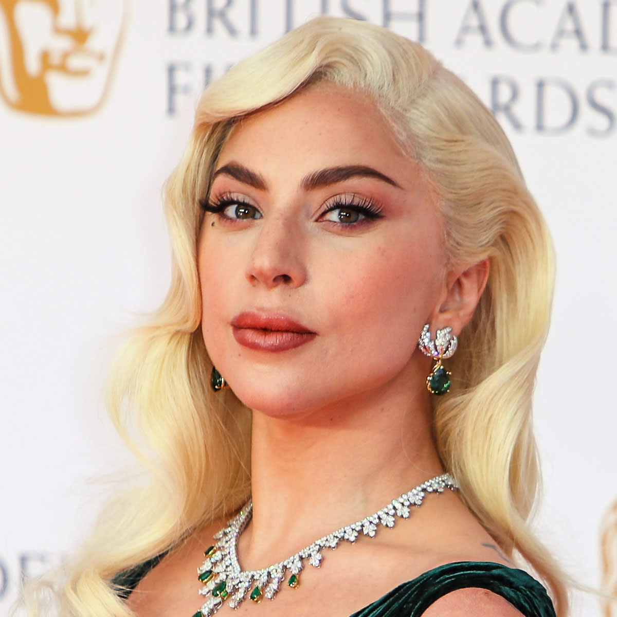 Lady Gaga walks the red carpet at the 2022 BAFTA awards