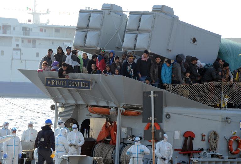 A boat transporting migrants arrives in the port of Messina after a rescue operation at see on April 18, 2015 in Sicily