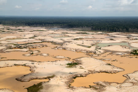 FILE PHOTO: An aerial view shows a deforested area of the Amazon jungle in southeast Peru caused by illegal mining, during a Peruvian military operation to destroy illegal machinery and equipment used by wildcat miners in Madre de Dios, Peru, March 5, 2019. REUTERS/Guadalupe Pardo/Pool/File Photo